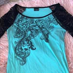 Turquoise Top with lace sleeves and black design